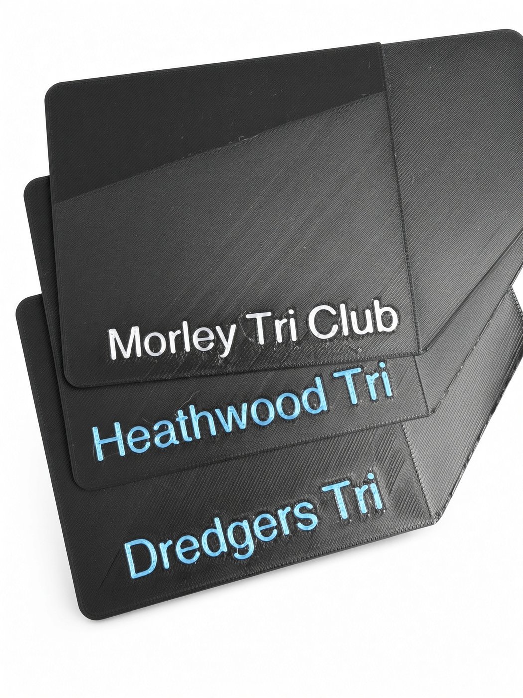 Custom black bike plates with club names in white and blue text